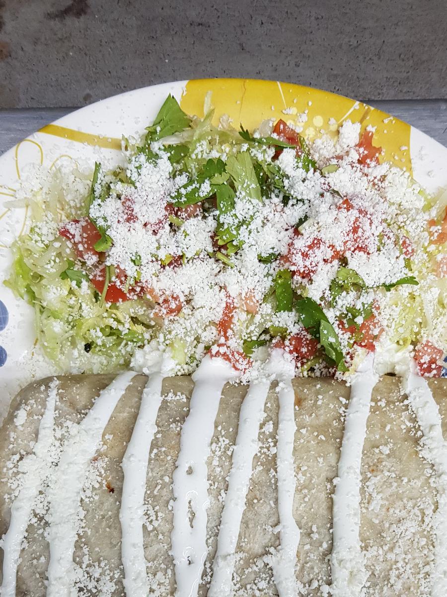 Burrito - Rice, beans, cheddar, side salad, sour cream and your choice of meat or veggies.